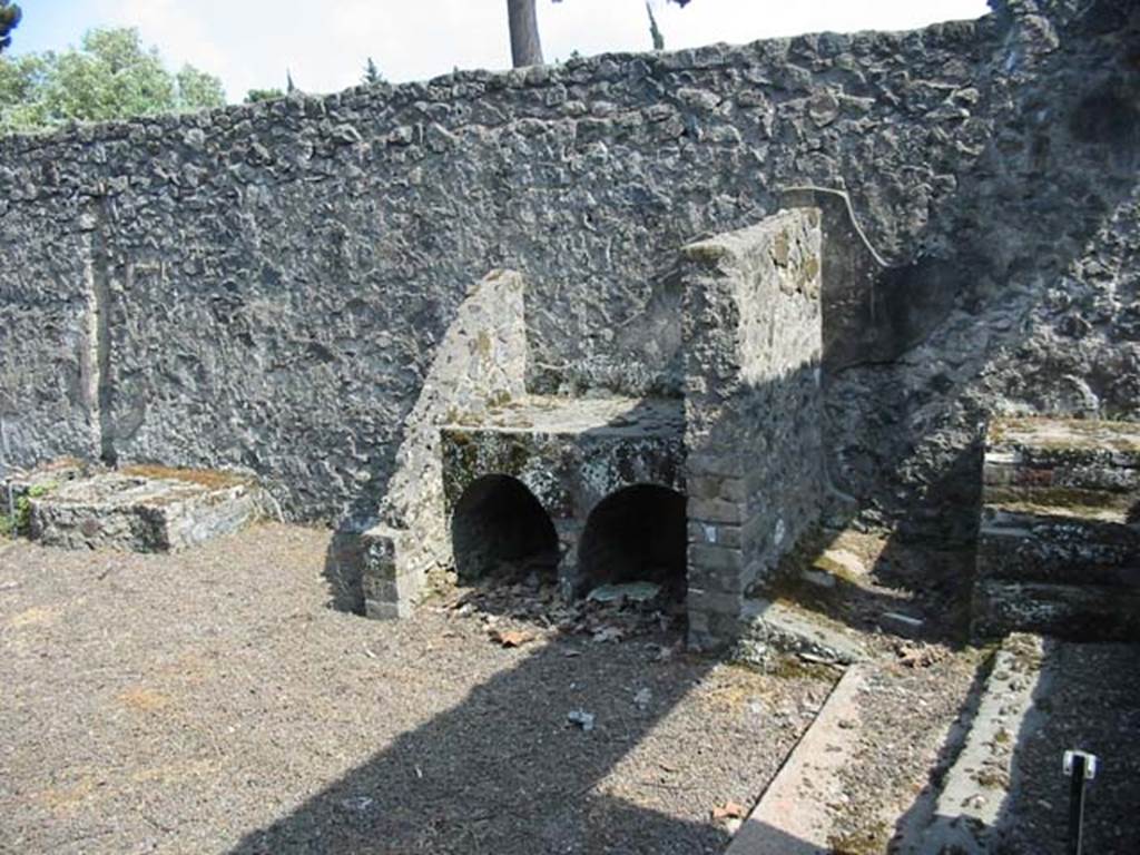 II.8.2 Pompeii. May 2003. Looking towards stone vat, hearth and steps against south wall.  Photo courtesy of Nicolas Monteix.
