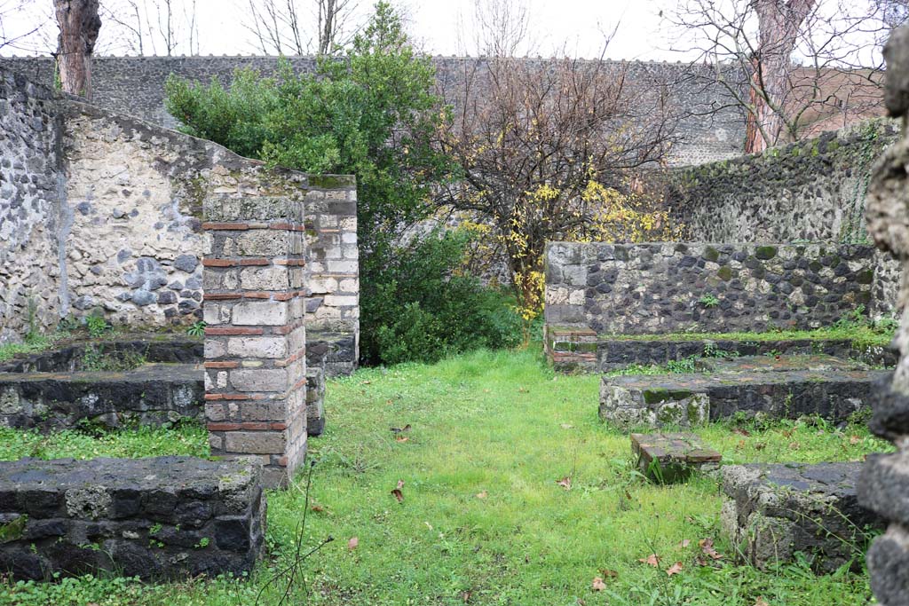 II.8.5 Pompeii. December 2018. Looking east across three-sided stone benches and tables. Photo courtesy of Aude Durand.