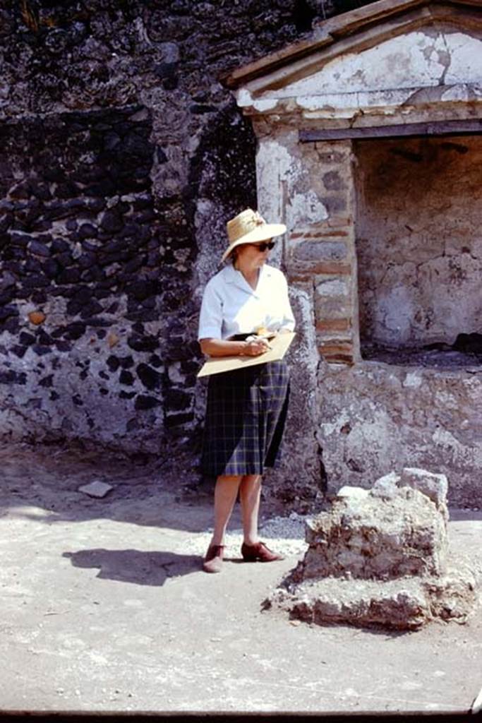 II.8.6 Pompeii, 1973. Wilhelmina on the north side of the lararium and altar. Photo by Stanley A. Jashemski. 
Source: The Wilhelmina and Stanley A. Jashemski archive in the University of Maryland Library, Special Collections (See collection page) and made available under the Creative Commons Attribution-Non Commercial License v.4. See Licence and use details. J73f0777
