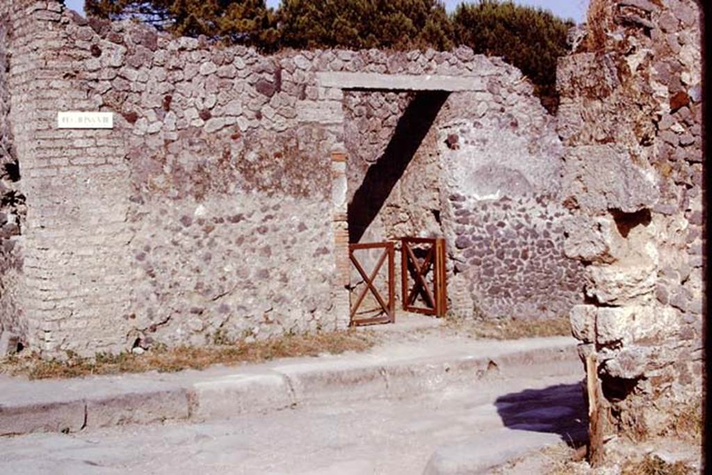 II.8.6 Pompeii. 1973. Entrance doorway. Looking east across Via di Nocera. Photo by Stanley A. Jashemski. 
Source: The Wilhelmina and Stanley A. Jashemski archive in the University of Maryland Library, Special Collections (See collection page) and made available under the Creative Commons Attribution-Non Commercial License v.4. See Licence and use details. J73f0224
