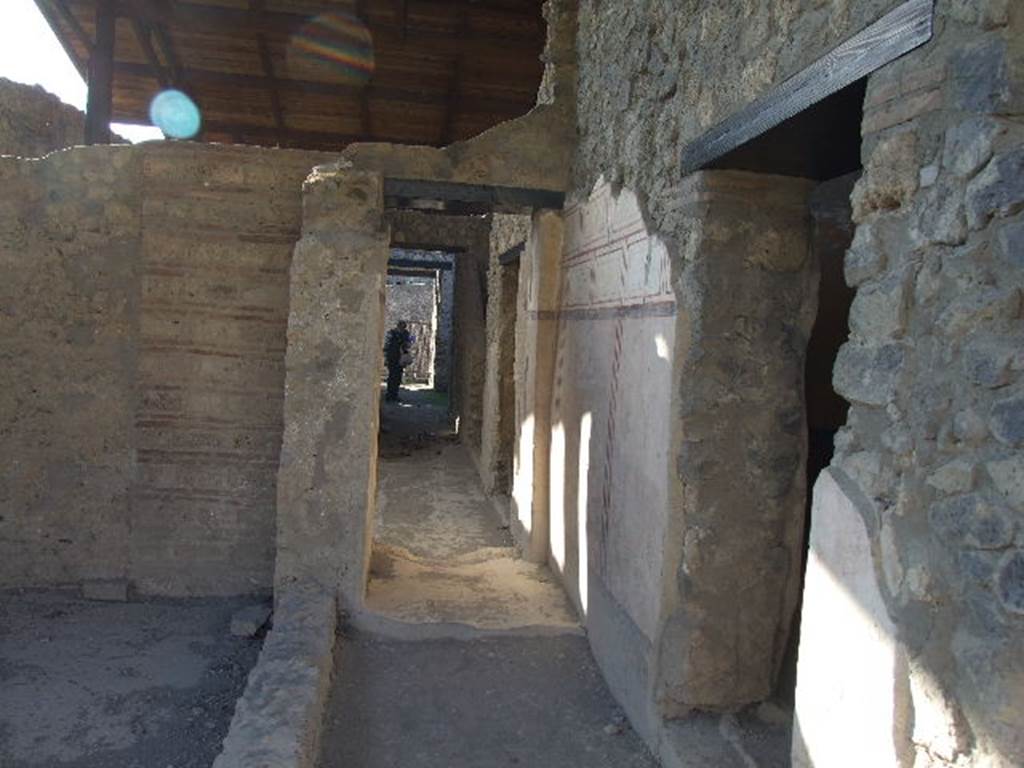 II.8.6 Pompeii. December 2006. Looking west along corridor towards entrance doorway.
The colourful walls of the room in the photos below, are through the doorway on the right.

