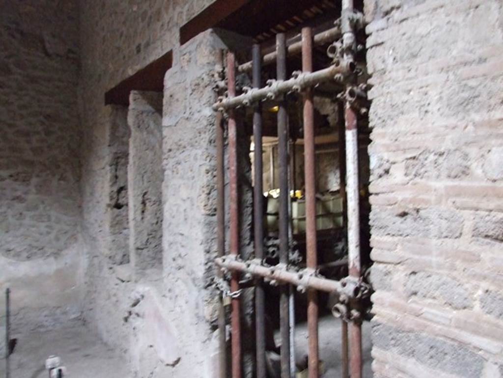 II.9.1 Pompeii. December 2007. West wall of atrium, and south west corner, with two windows and blocked doorway to room 2.   