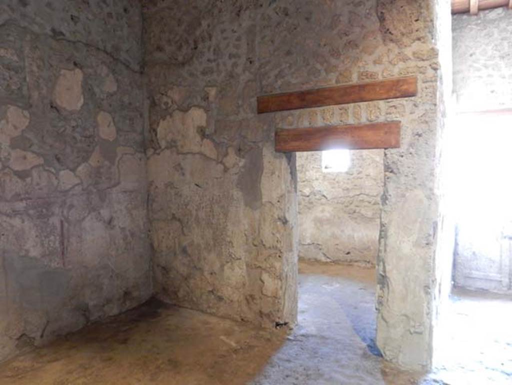 II.9.3, Pompeii. May 2018. Doorway to room 12, in south-west corner of atrium, room 11.
Photo courtesy of Buzz Ferebee. 
