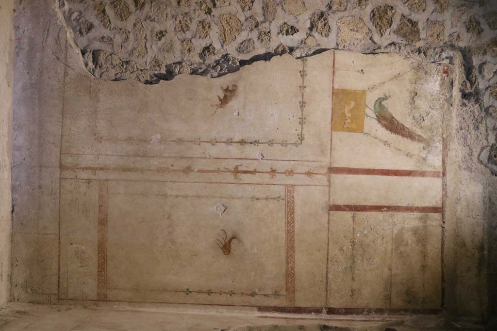 II.9.4, Pompeii. May 2018. Room 4, east wall at south end with painted decoration. 
Photo courtesy of Buzz Ferebee. 
