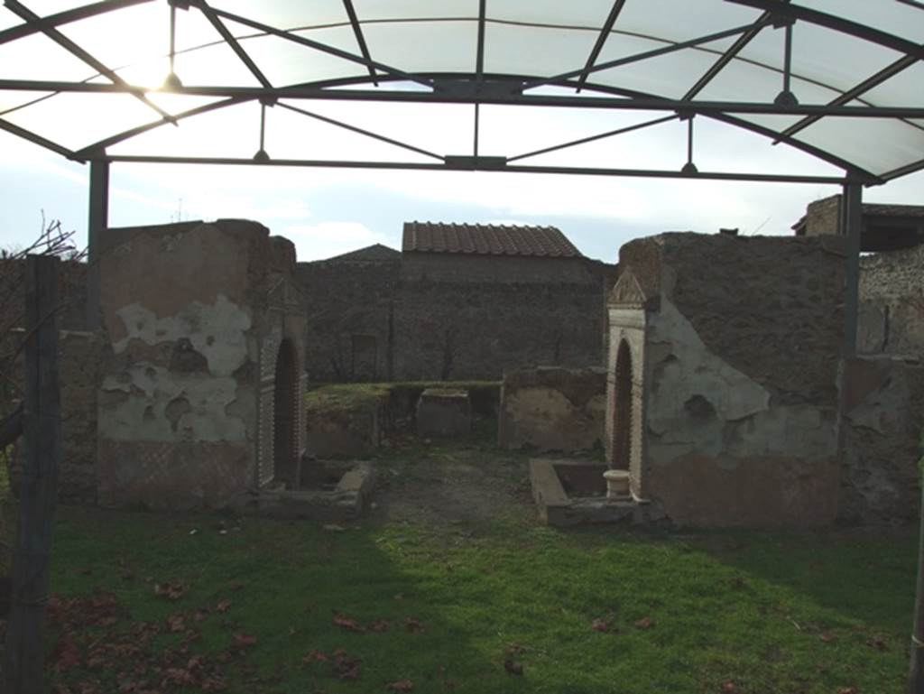 II.9.7. Garden entrance to House of Summer Triclinium.  December 2007.  Looking west at the two fountains and a triclinium.