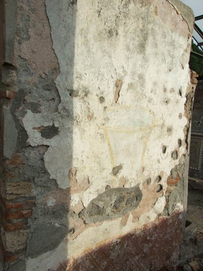 II.9.7. Garden entrance to House of Summer Triclinium.  December 2007.  West side face of north fountain.  Painted urn.