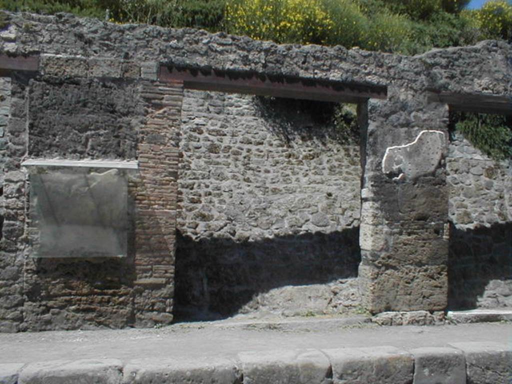 III.1.2 Pompeii. May 2005. Shop entrance, partly excavated. For the graffiti between III.1.1 and 2, on the left, see III.1.1. For the graffiti between III.1.2 and 2, on the right, see III.1.3.
