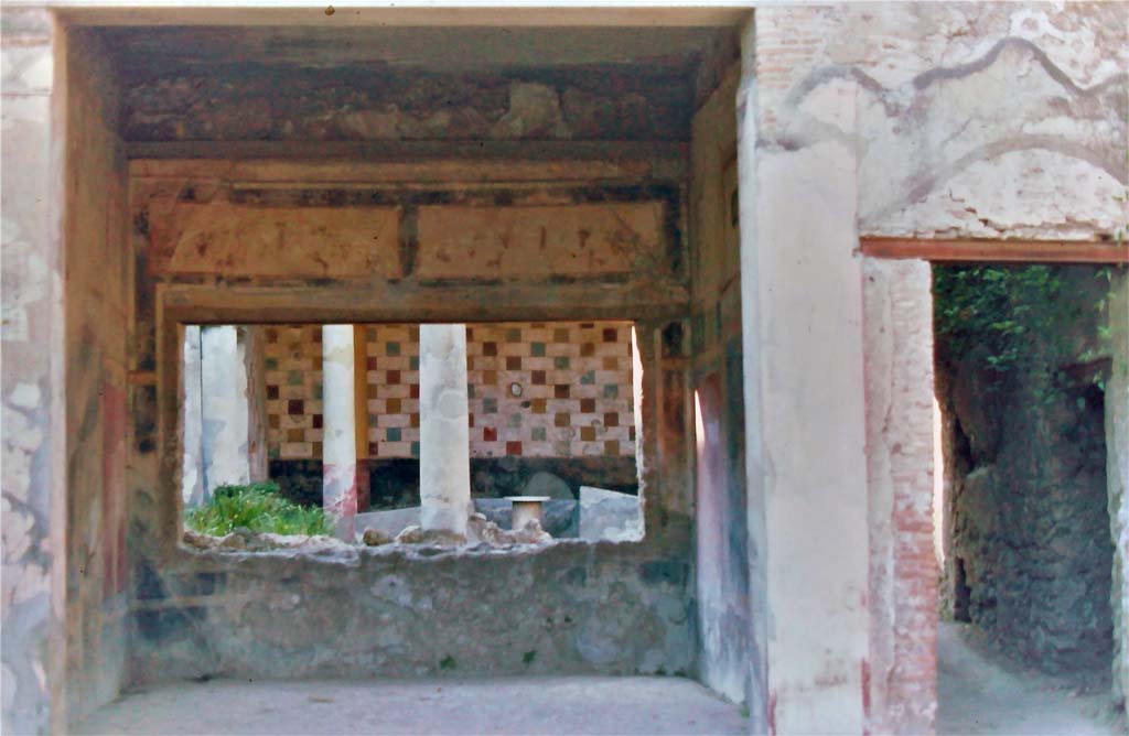 III.2.1 Pompeii, 7th August 1976. 
Looking north across tablinum to peristyle, with doorway to rear corridor and peristyle, on right.
Photo courtesy of Rick Bauer, from Dr.George Fays slides collection.
