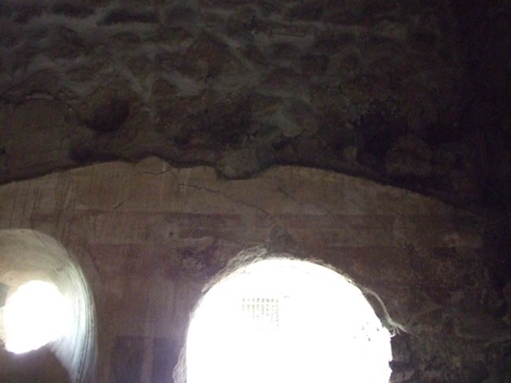 III.2.1 Pompeii.  March 2009.  Room 12. Apodyterium.  Upper section of north wall, small circular window  and door to portico.