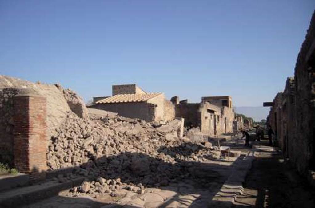 III.3.5 and 6 Pompeii. November 2010. Looking east along Via dellAbbondanza, from near III.3.4 (pilaster on left).
