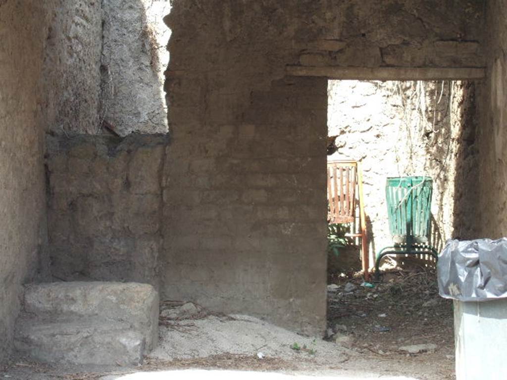 III.5.1 Pompeii. September 2005. Steps to upper floor with two steps remaining. To the right is the door to the rear room which has a window to the north, which is not excavated. According to Liselotte Eschebach, this may have been a grocery shop. The upstairs may have been rented out as a workshop. Tools and furniture fittings were found there. See Eschebach, L., 1993. Gebudeverzeichnis und Stadtplan der antiken Stadt Pompeji. Kln: Bhlau. (p. 107).