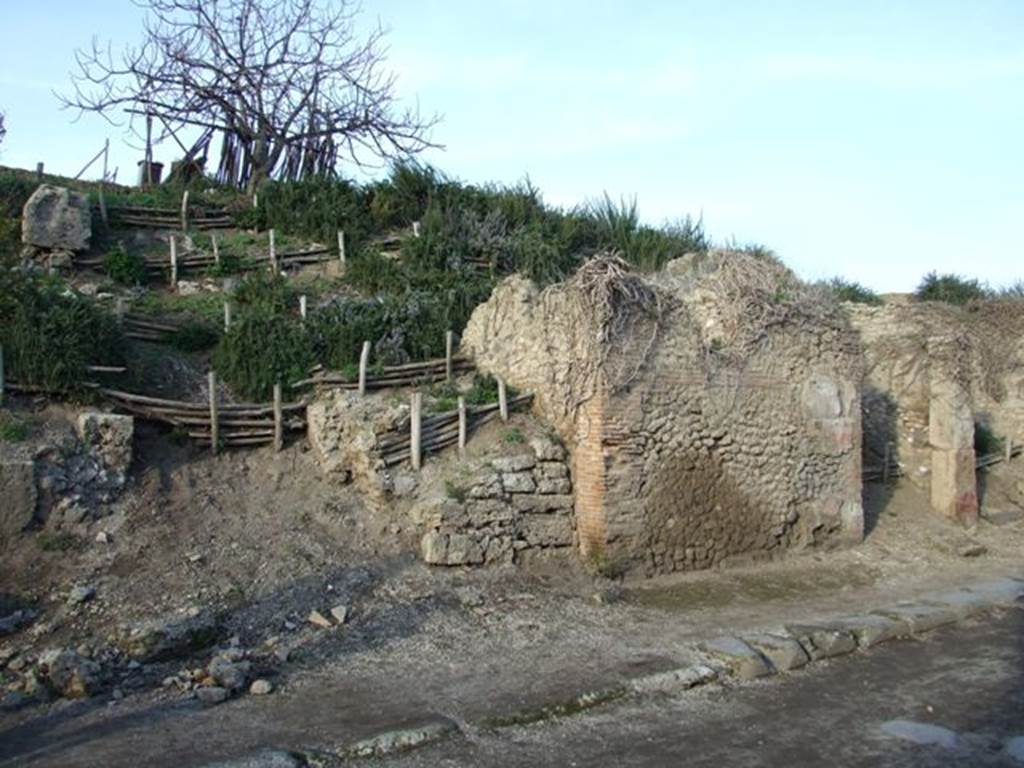 III.6.4 Pompeii. December 2007. Blocked entrance doorway next to brick pilaster, with other entrance to III.6.5, seen on the right.                                                                                            