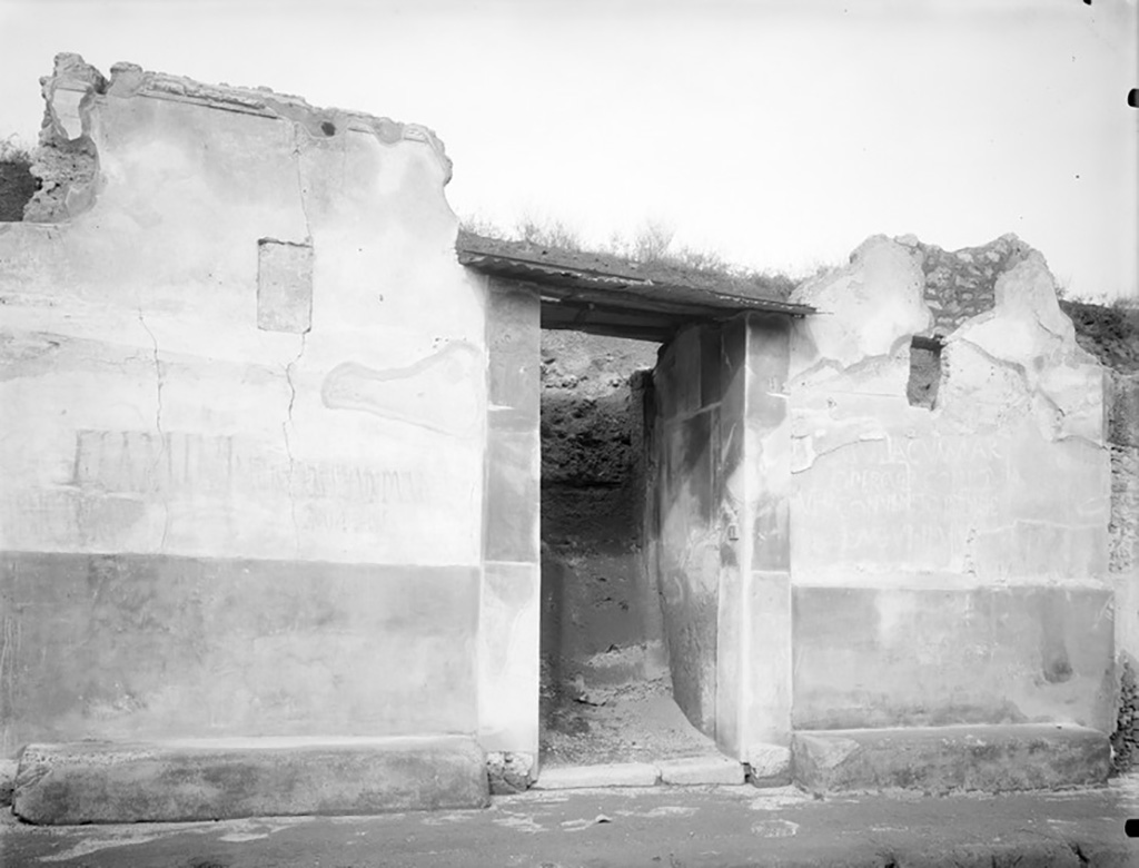 III.7.1 Pompeii. Wall to the east of entrance with graffiti. c.1936?