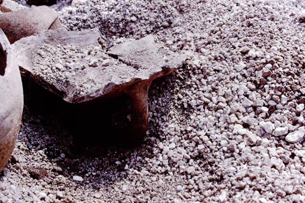 III.7 Pompeii. 1976. Top part of large amphora, used as a brazier. Photo by Stanley A. Jashemski.   
Source: The Wilhelmina and Stanley A. Jashemski archive in the University of Maryland Library, Special Collections (See collection page) and made available under the Creative Commons Attribution-Non Commercial License v.4. See Licence and use details. J76f0433
