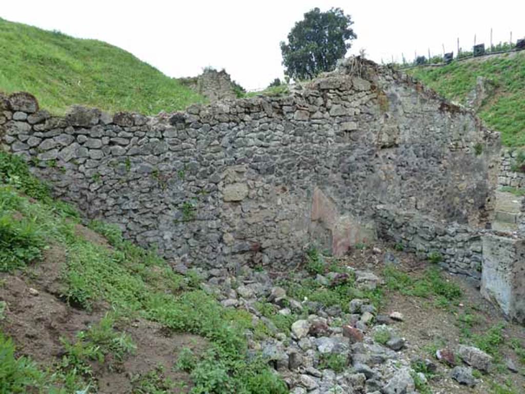 III.8.4 Pompeii. May 2010.  West side of atrium, and blocked doorway from III.8.3, on right.