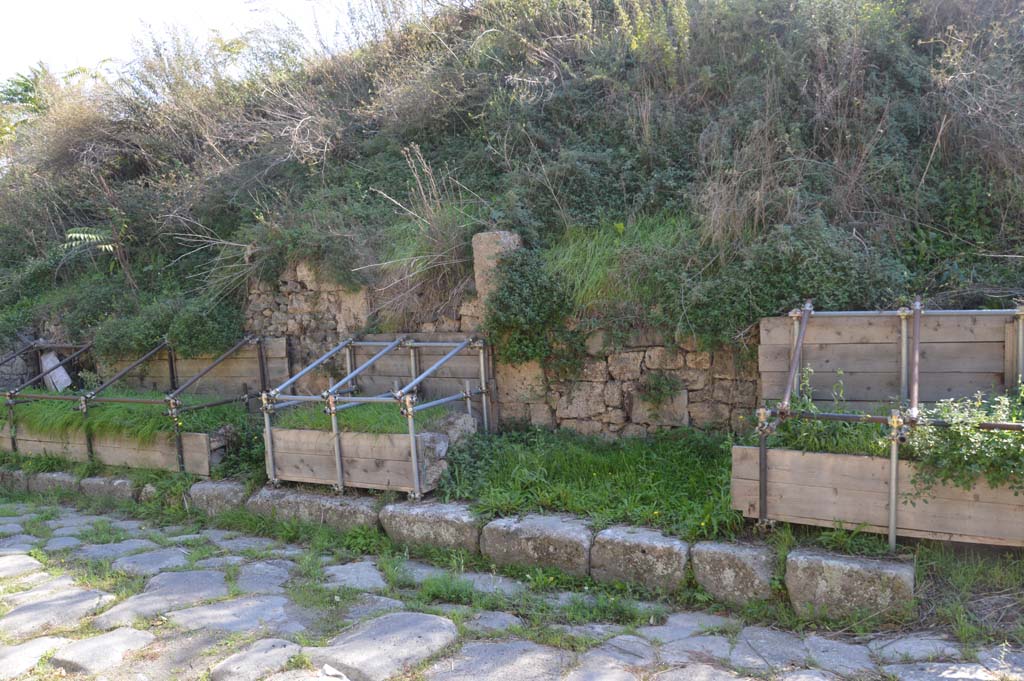 Via di Nola, south side, Pompeii. October 2017. 
Looking towards entrance doorways at III.9.3, III.9.2 and III.9. 1, with unexcavated roadway, on right.
Foto Taylor Lauritsen, ERC Grant 681269 DCOR.
