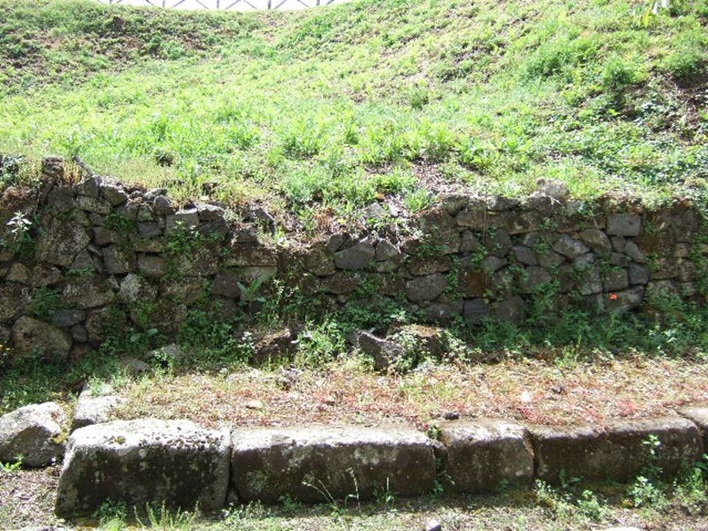 III.9.6 Pompeii. May 2005. Site of entrance at end of insula. The break in the paving blocks indicates the small vicolo, leading south, between III.10 and III.9