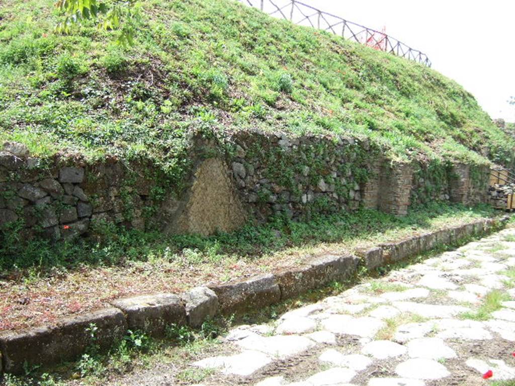 III.9.6, III.9.5, III.9.4 Pompeii. May 2005.  Entrances on Via Nola, looking west.