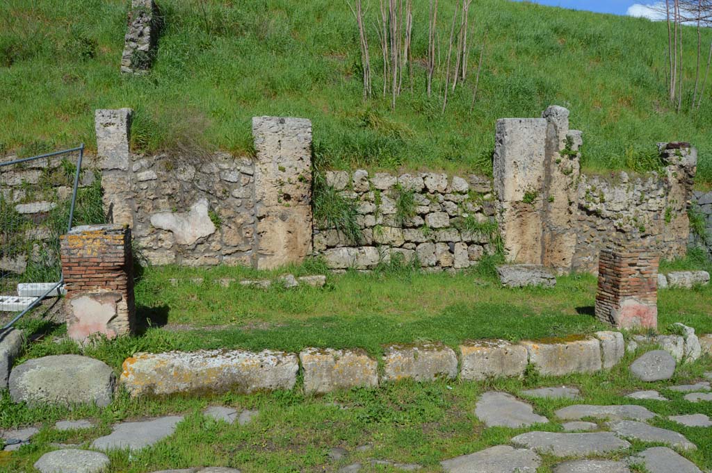 IV.2.a, Pompeii. March 2018. 
Looking north from Via di Nola, across a small portico with two pilasters for holding up a balcony, towards entrance doorway.
Foto Taylor Lauritsen, ERC Grant 681269 DCOR.
