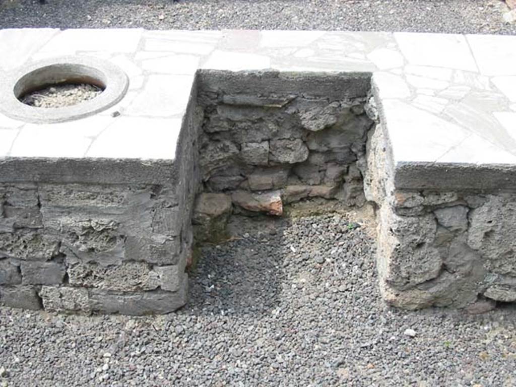 V.1.1 Pompeii. May 2003. Looking towards area of hearth on west side of counter. 
Photo courtesy of Nicolas Monteix.
