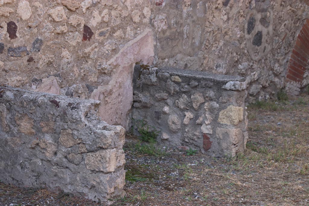 V.1.2 Pompeii. October 2023. Detail from podium/structure near west wall. Photo courtesy of Klaus Heese.