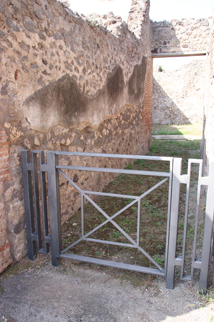 V.1.3 Pompeii. October 2023. 
Looking north along west wall of entrance corridor/fauces. Photo courtesy of Klaus Heese.
