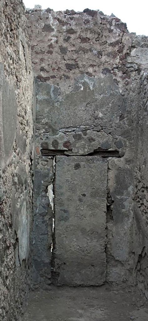 V.1.3 Pompeii. c.2008-10.  
Room 3, east wall of corridor with blocked doorway, which would have linked to V.1.7.
Photo by Hans Thorwid.
Photo courtesy of the Swedish Pompeii Project. 
