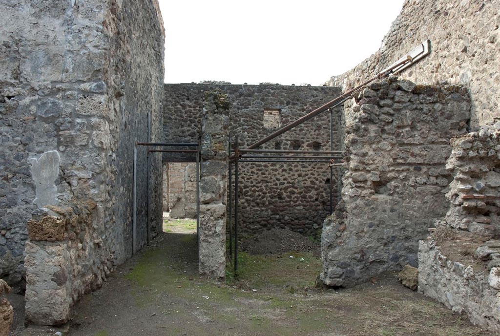 V.1.10/23 Pompeii. c.2005-7. 
Room 17, looking west across kitchen area towards corridor to garden area, and stable, on right. Photo by Hans Thorwid.
Photo courtesy of the Swedish Pompeii Project.
