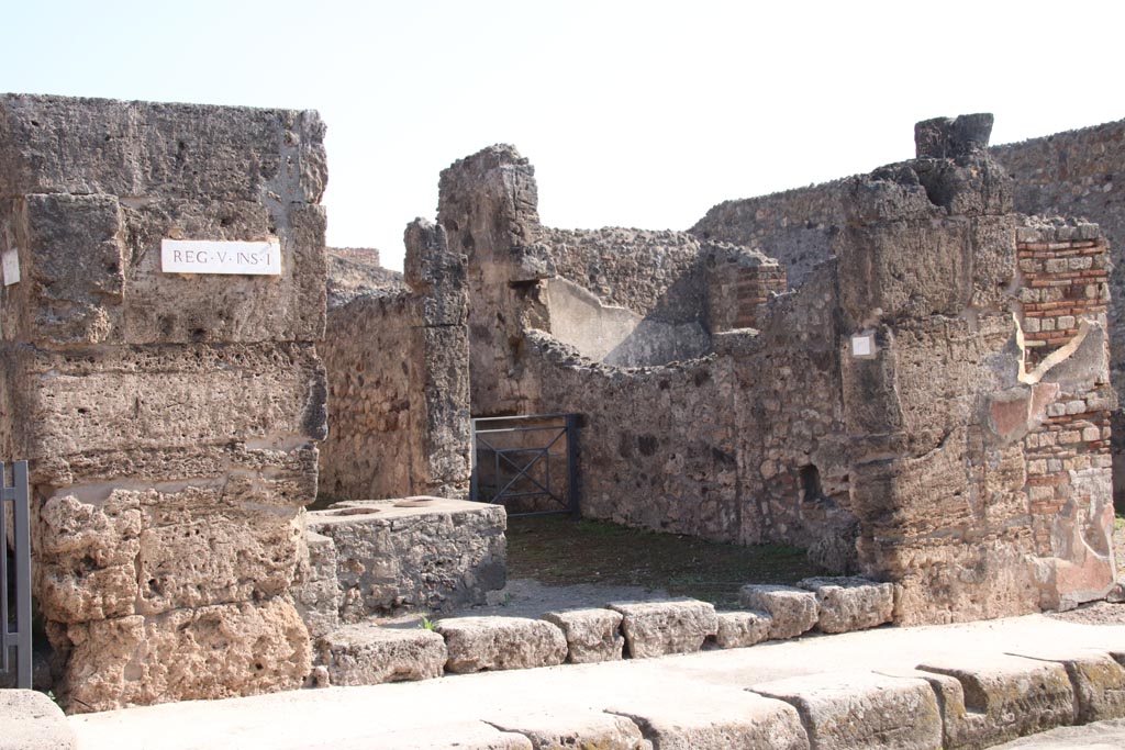 V.1.13 Pompeii. October 2023. Looking south-east towards entrance doorway on Via Stabiana. Photo courtesy of Klaus Heese.