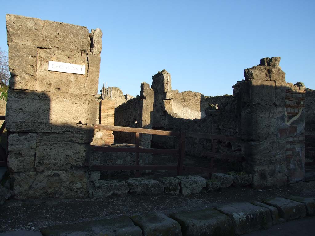 V.I.13 Pompeii. December 2006. Entrance, looking east. This area was hit by two bombs in 1943, and badly damaged and ruined.
See Garcia y Garcia, L., 2006. Danni di guerra a Pompei. Rome: L’Erma di Bretschneider. (p.60).
