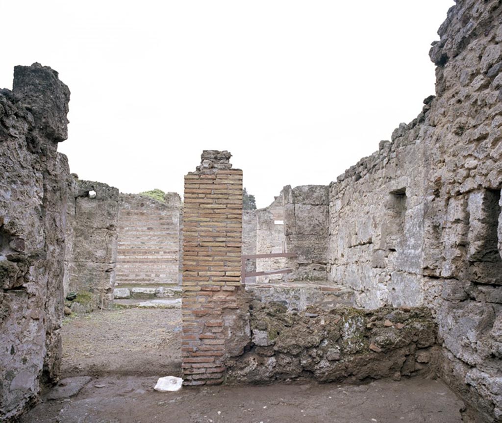 V.1.13 Pompeii. c.2004-6?   
Looking towards doorway to bar-room in west wall of rear room. Photo by Hans Thorwid. 
Photo courtesy of the Swedish Pompeii Project.
