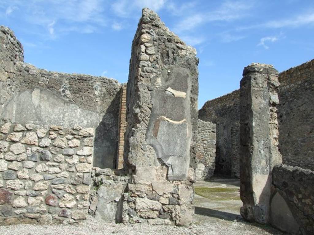 V.I.14 Pompeii. March 2009.  East wall, with doorway to atrium of V.1.15