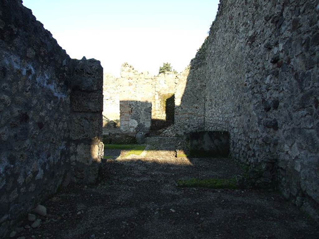 V.I.16 Pompeii. December 2006. Bakery shop, looking east into atrium of V.1.15 to rear.   