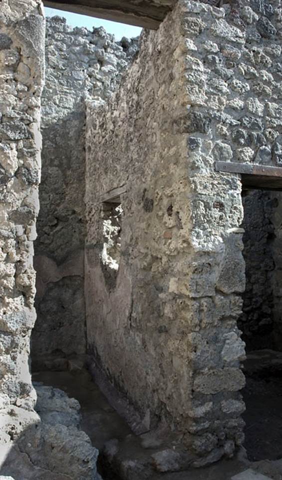 V.1.20 Pompeii. 2005. Room “f”. Photo by Hans Thorwid.
South wall of room with tall doorway in east wall of kitchen.  
Photo courtesy of The Swedish Pompeii Project.
