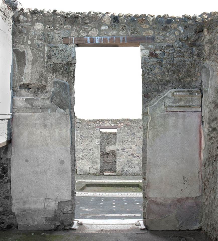 V.1.26 Pompeii. c.2003-07. 
Room “d”, south wall with doorway to atrium. Photo by Hans Thorwid.
Photo courtesy of The Swedish Pompeii Project.
