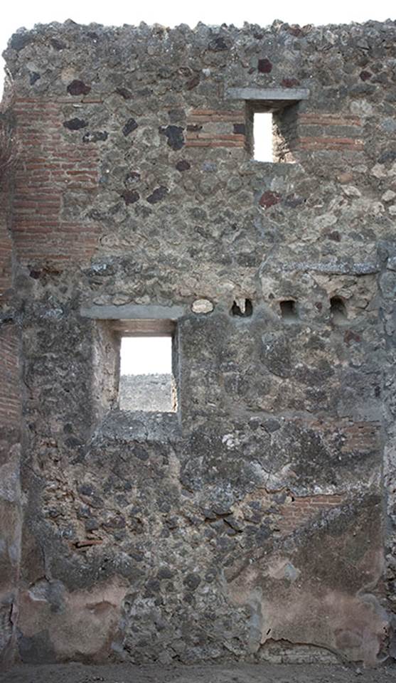 V.1.28 Pompeii. c.2008-10.  
West wall of room “e”, a room on west side of room “b”. Photo by Hans Thorwid.
Photo courtesy of The Swedish Pompeii Project.
