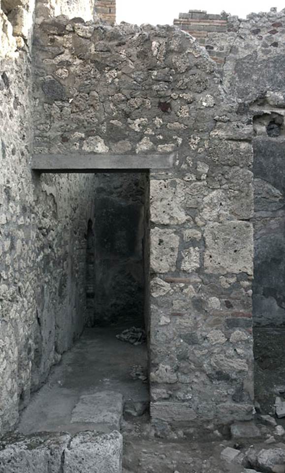 V.1.31 Pompeii. c.2010. 
Looking towards north end of east wall of shop-room. Photo by Hans Thorwid.
“Room 3 is a corridor, leading to a latrine niche situated in the north-east corner of the taberna.”
Photo and words courtesy of The Swedish Pompeii Project.
