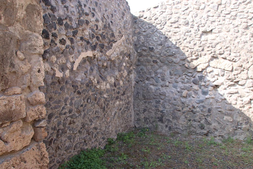 V.2.2 Pompeii. October 2023. Looking through doorway of rear room towards north-west corner. Photo courtesy of Klaus Heese.