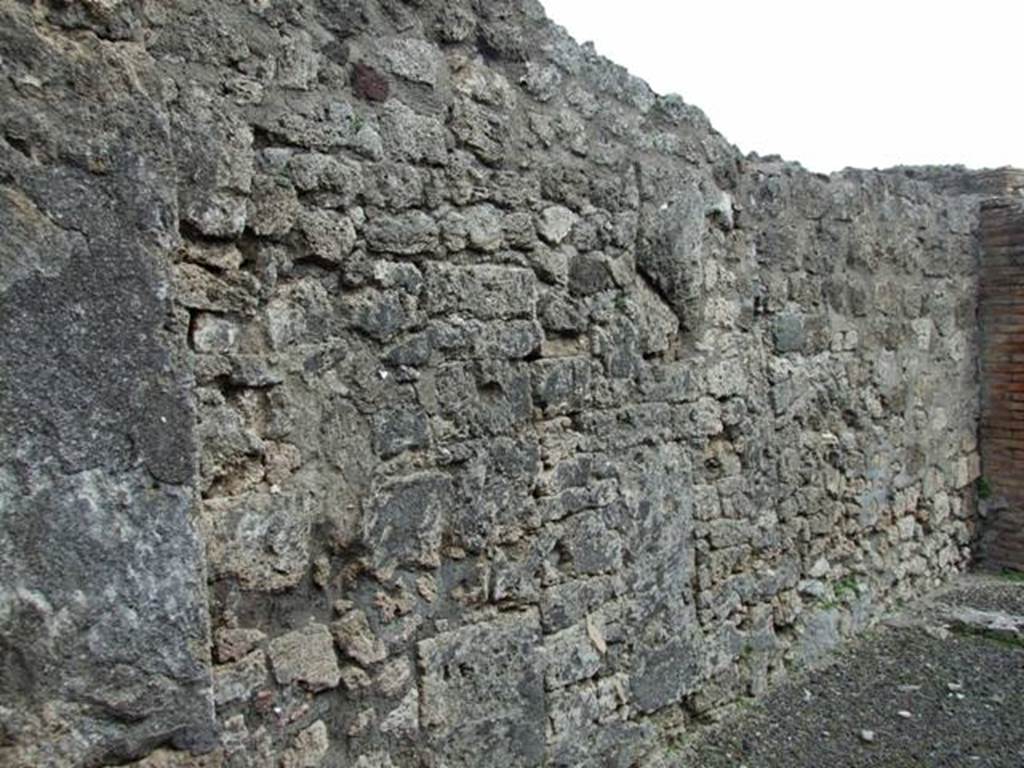 V.2.2 Pompeii. March 2009. Looking south along east wall of shop-room “f”.