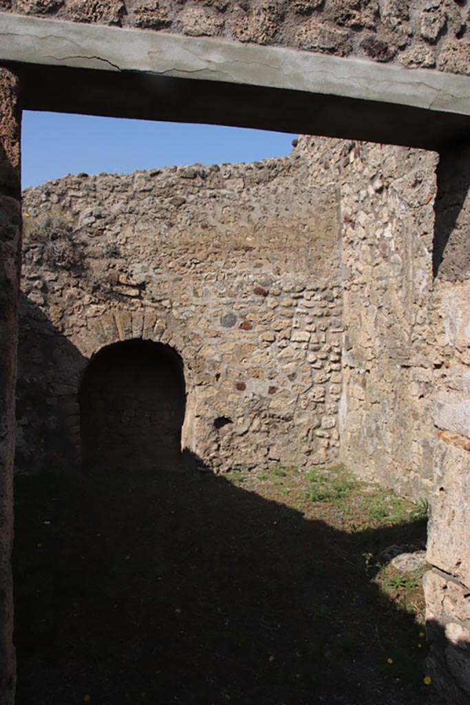 V.2.3 Pompeii. October 2023. 
Looking north-east through doorway of rear room. Photo courtesy of Klaus Heese.
