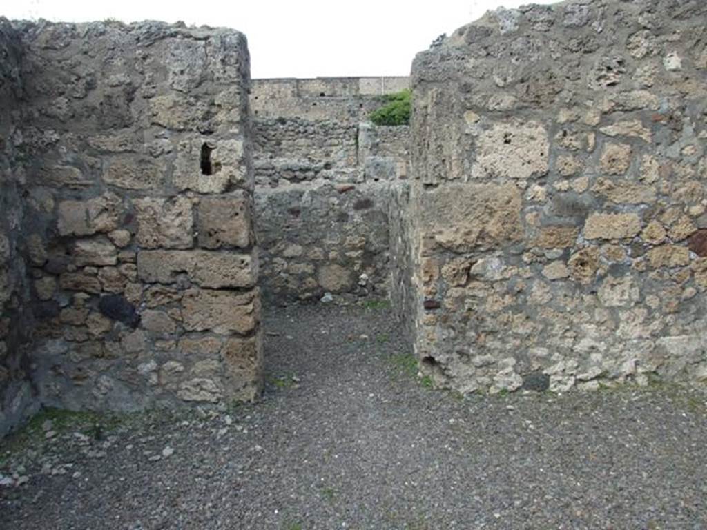 V.2.6 Pompeii.  March 2009.  North wall of shop, and doorway to rear room.