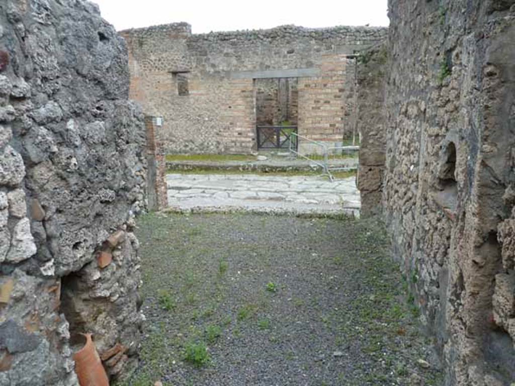 V.2.9 Pompeii. May 2010. Looking south across shop from rear room, towards Via di Nola.