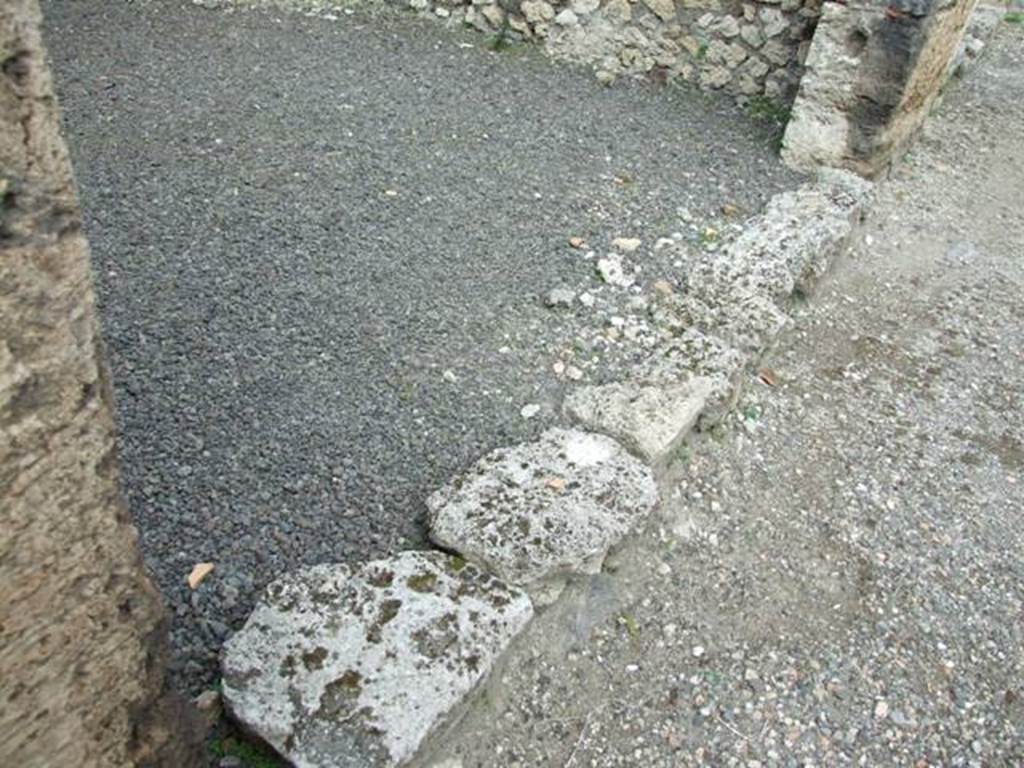 V.2.12 Pompeii. March 2009. Threshold or sill of shop area.