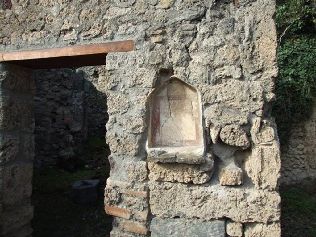 V.2.15 Pompeii. December 2007.  Lararium niche. Niche on north wall of peristyle between room 9 and room 8.  According to Boyce, painted underneath the niche was the altar with two serpents.  On the altar were two eggs and a pine cone. See Boyce G. K., 1937. Corpus of the Lararia of Pompeii. Rome: MAAR 14.  (No. 94 on p.35)