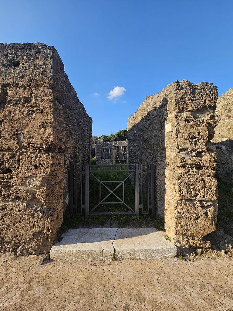 V.2.15, Pompeii. November 2024. Looking north to entrance doorway. Photo courtesy of Annette Haug.