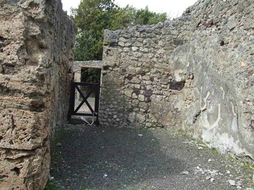 V.2.16 Pompeii.  March 2009. Looking north across shop.  The outline of the wooden stairs can be seen on the east wall.