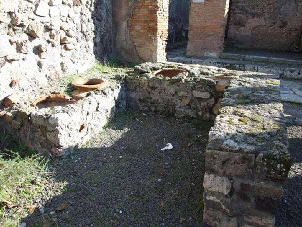 V.2.19 Pompeii. December 2007. Looking south from rear of counter towards Via di Nola.  