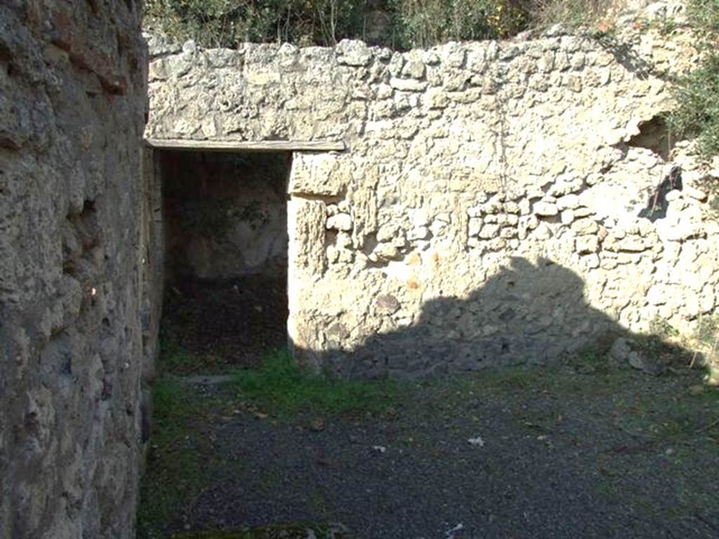 V.2.20 Pompeii. December 2007. Looking north across light-yard towards doorway to triclinium with window overlooking garden.