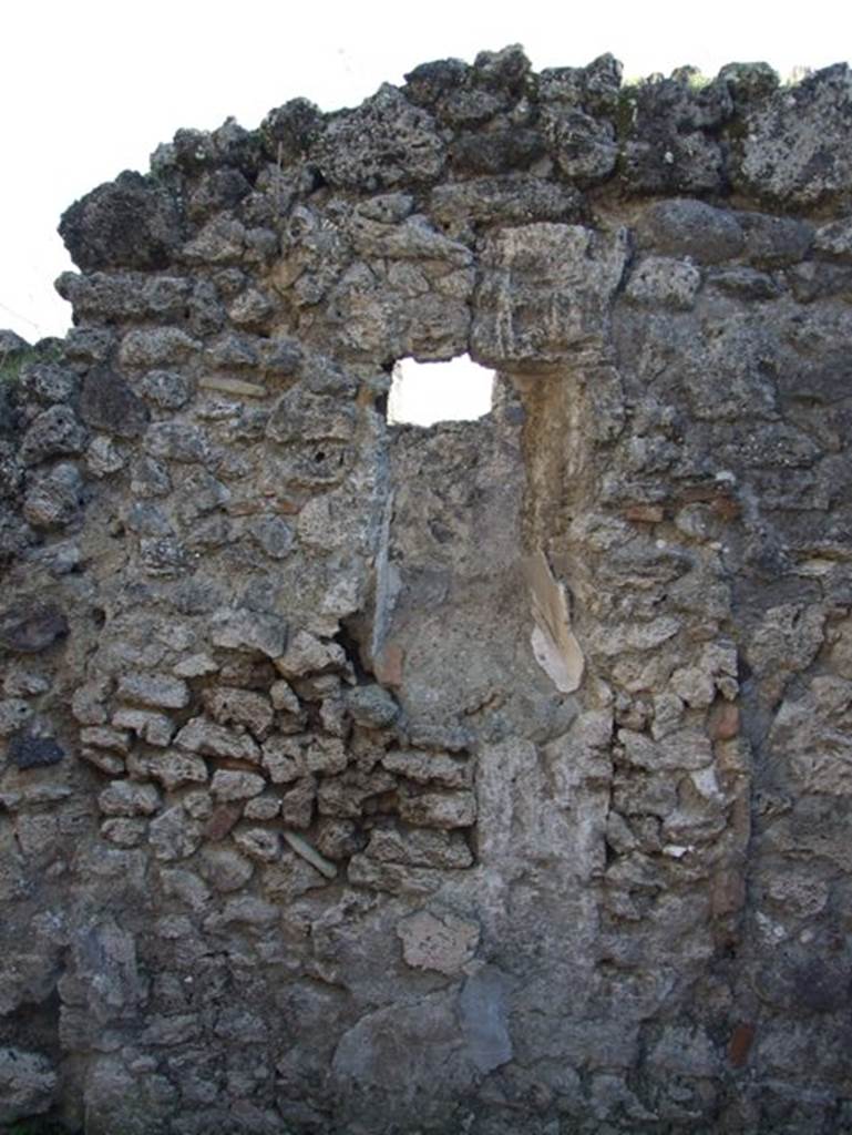 V.2.20 Pompeii. December 2007. 
Small room on west side of light-yard, remains of window in north wall overlooking garden area.
