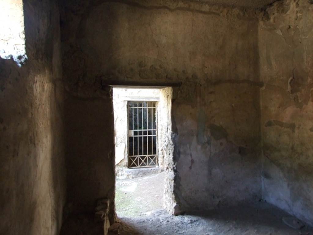 V.2.i Pompeii. March 2009.  Room 2,  East wall, with doorway to entrance corridor, and Room 3a directly opposite.